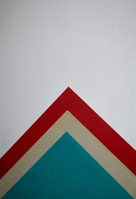 an abstract po of three different colors of paper