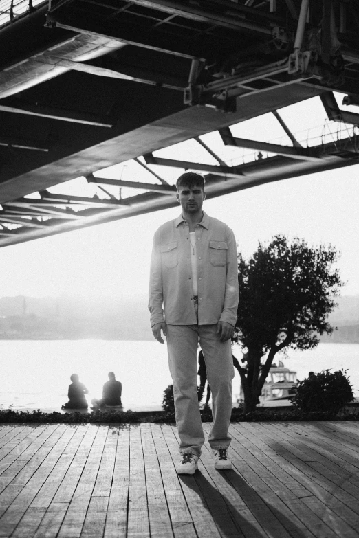 man standing on a wooden floor looking off to the side