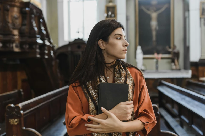 an image of a woman holding a bible