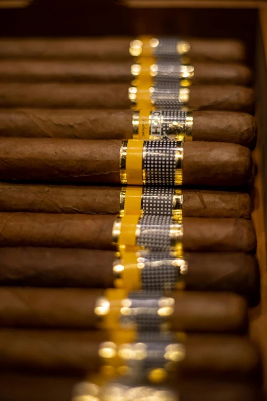 cigars are shown with yellow tapes around them