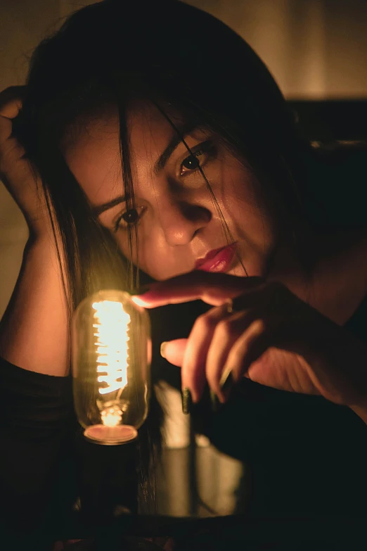 woman holding a light in her hands