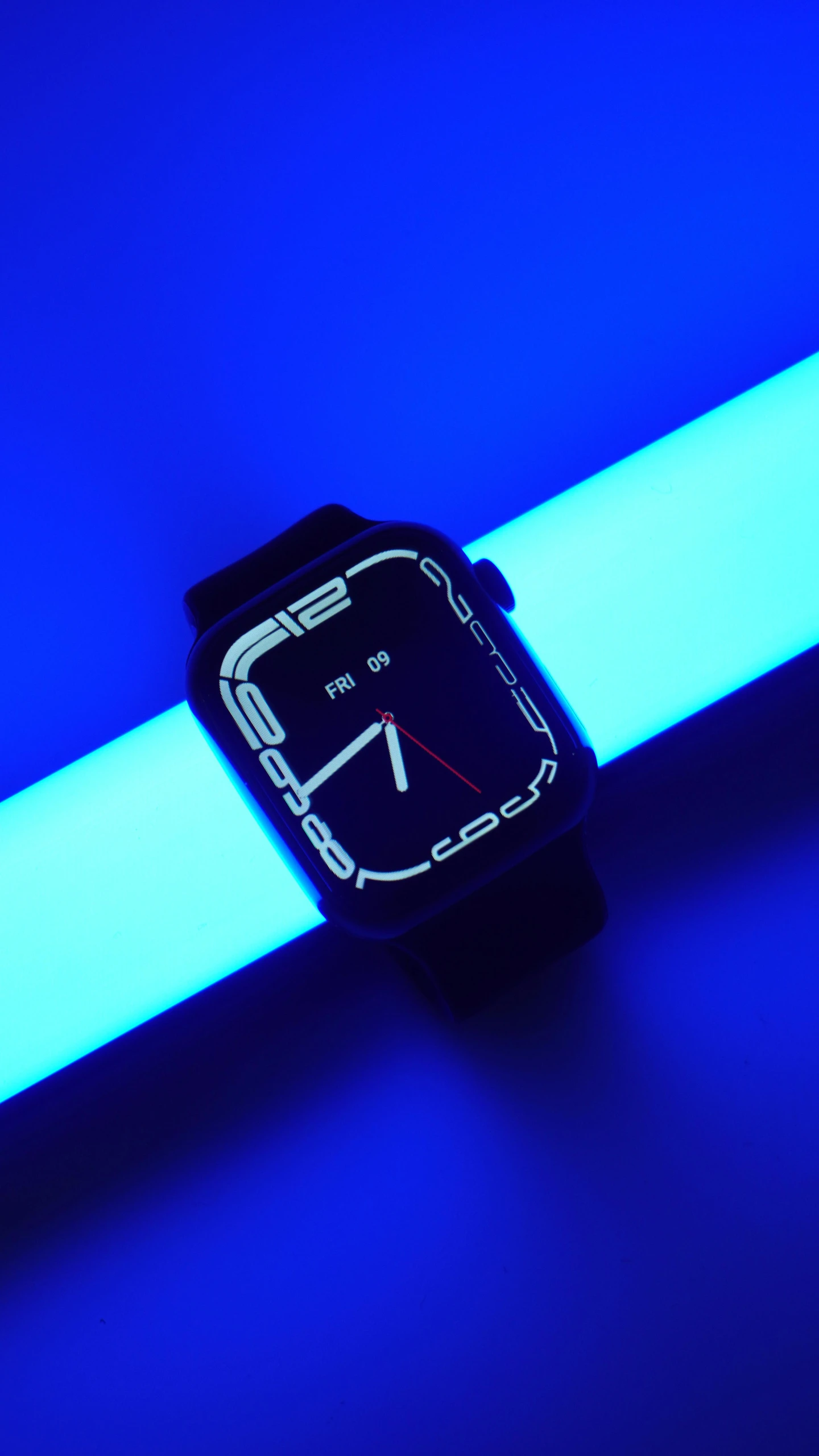 a watch with blue light shining on it