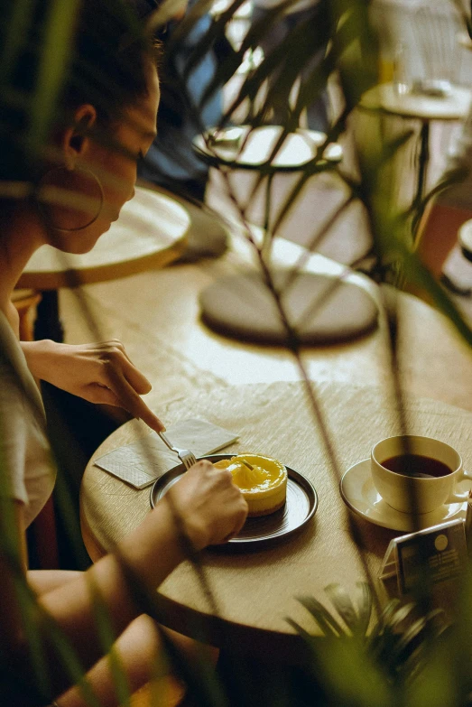 a person  an orange at a table