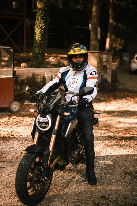 a man that is sitting on a motorcycle