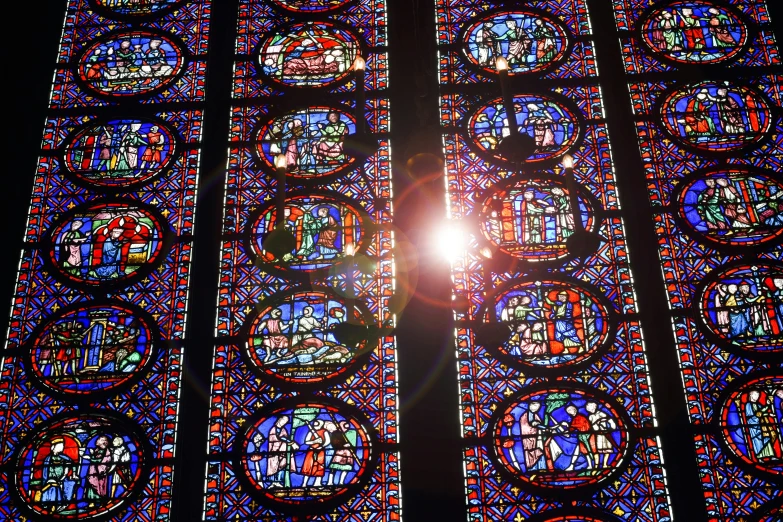 an image of a bright sun shining through the glass windows