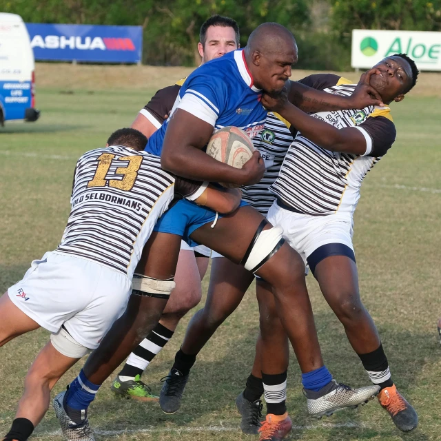 two players fight for control on the field