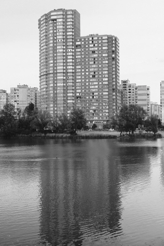 the city skyline in black and white has tall buildings