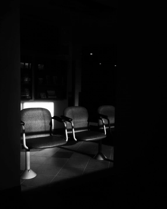 an empty seat sits in the dark