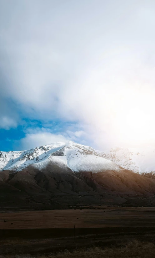 the snow covered mountains are visible from the distance