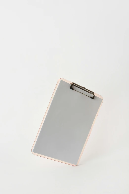 a clipboard on a white background with some pink details