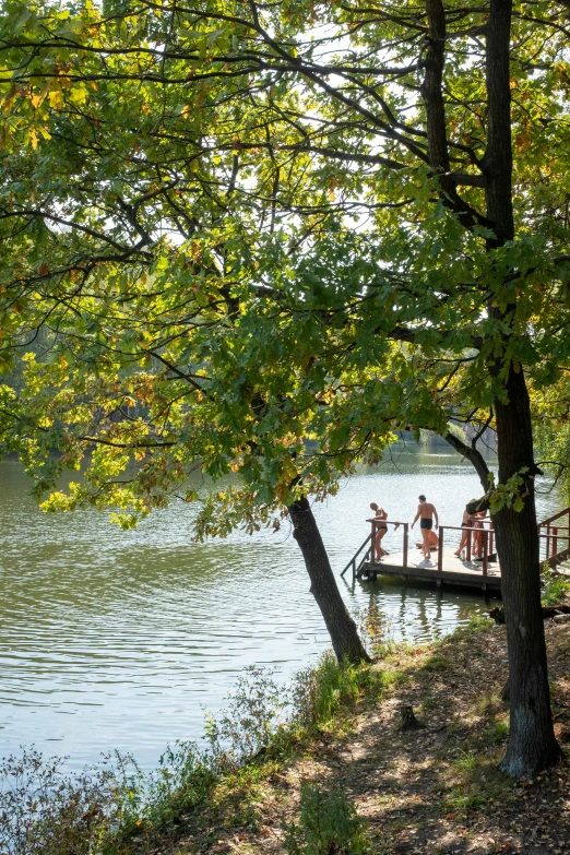 a small boat with people floating on it in the water