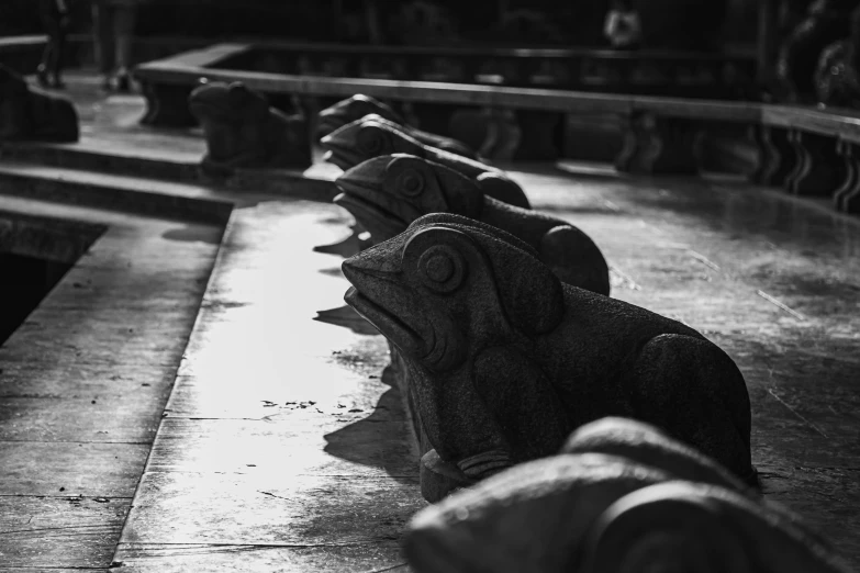 several benches lined up in a row on the sidewalk