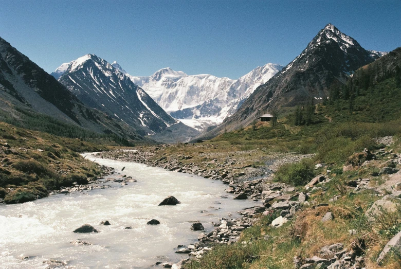 a very pretty stream flowing through a small valley