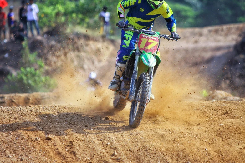 a dirt bike rider on a dirt bike course