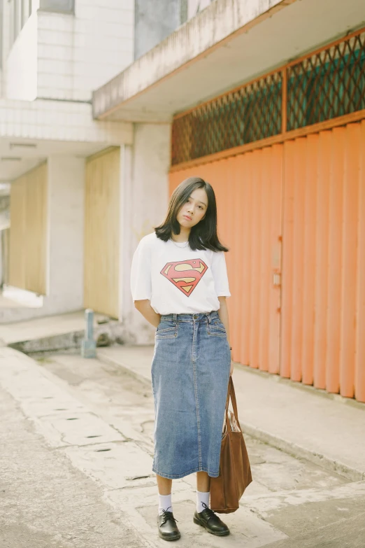 a woman wearing a t - shirt with a superman design