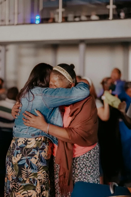 two people hug as they hug each other