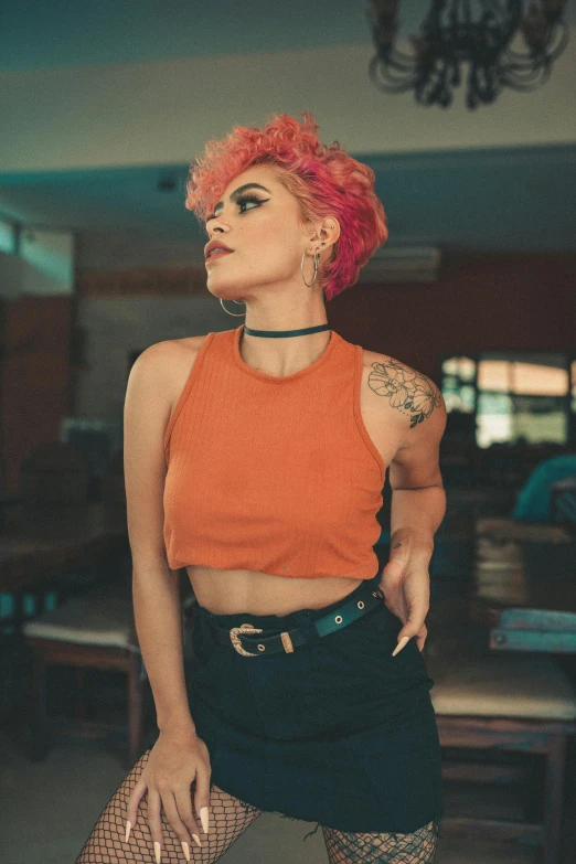 a woman with bright pink hair posing for a po