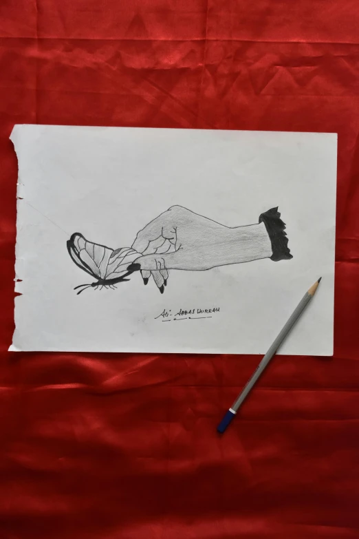 a drawing of a persons feet next to a pen