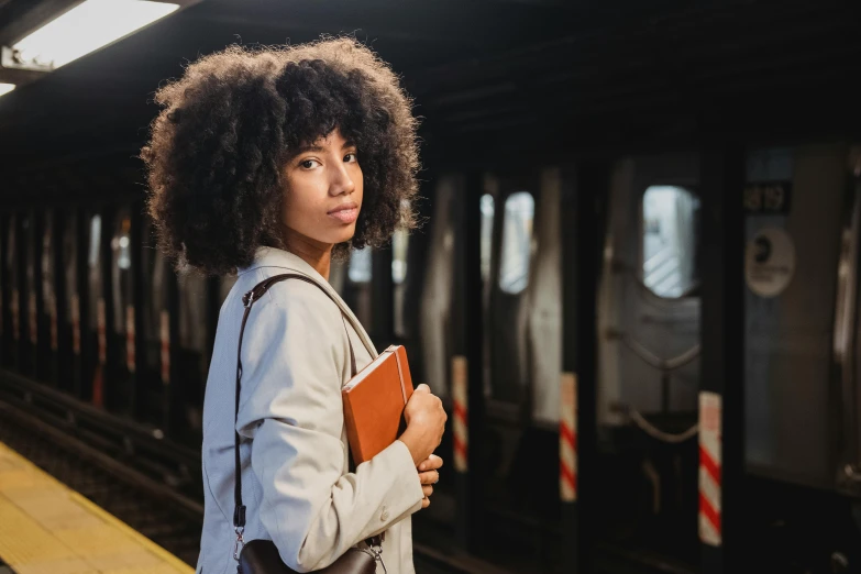 a  waiting for a subway to arrive