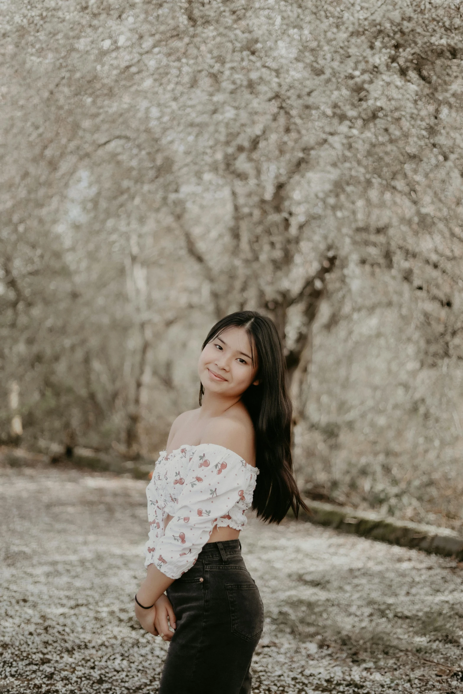 a beautiful woman posing for a po with flowers