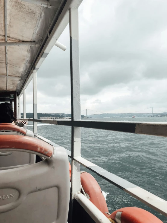 the front end of a boat and a red and white seat