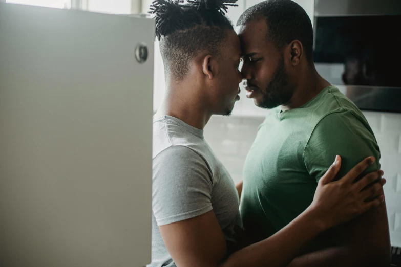 two people who are in the kitchen together