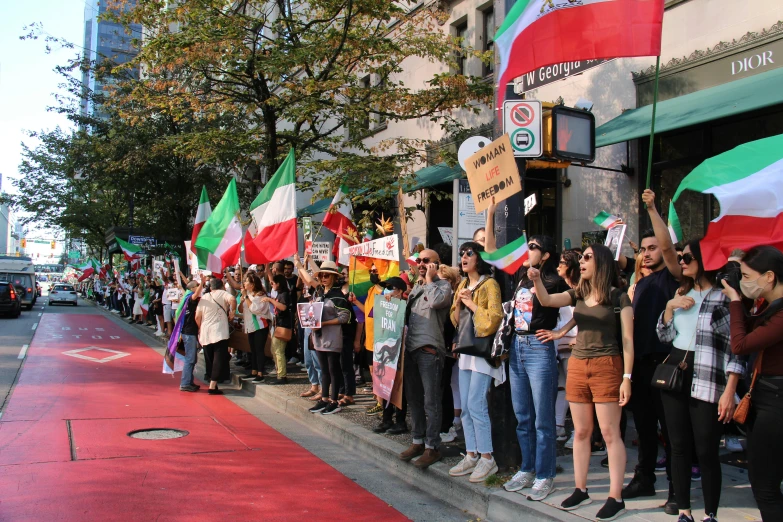 a long line of protesters are on the street