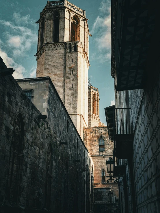 an ancient stone building with a massive tower