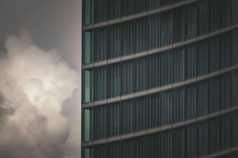 a plane flies low in the sky, near the clouds