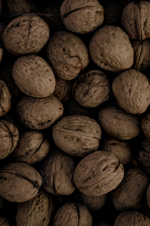 a picture of many peanuts with some shells inside