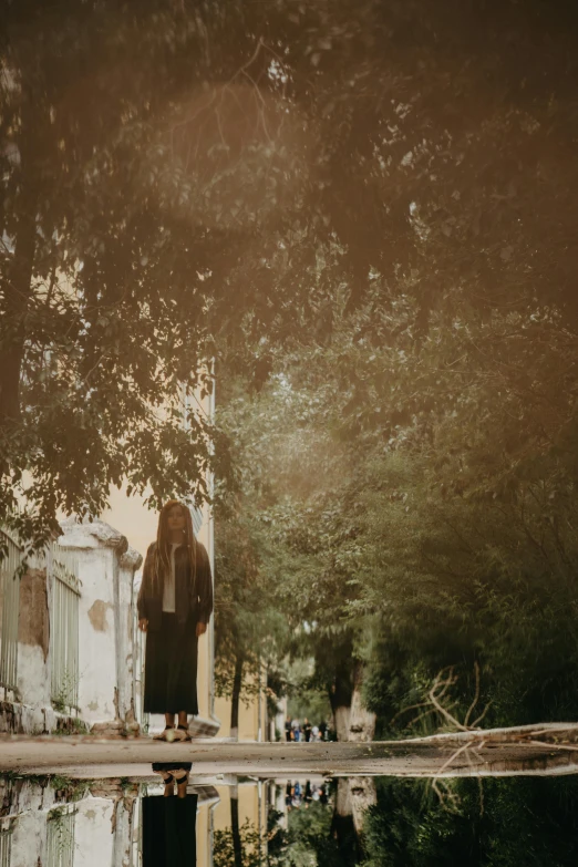 an old po of a man standing near the water