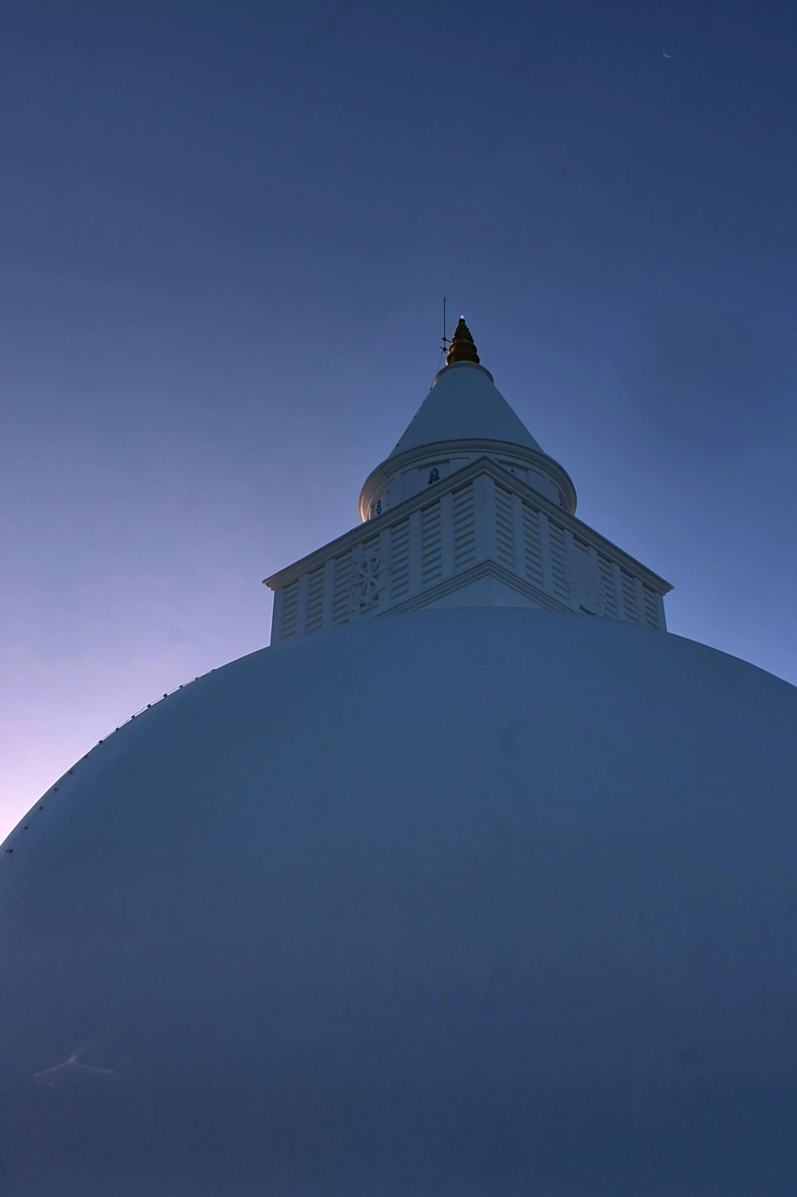 a very large dome structure with a clock at the top