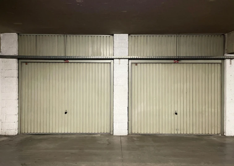 a garage with three doors open near each other