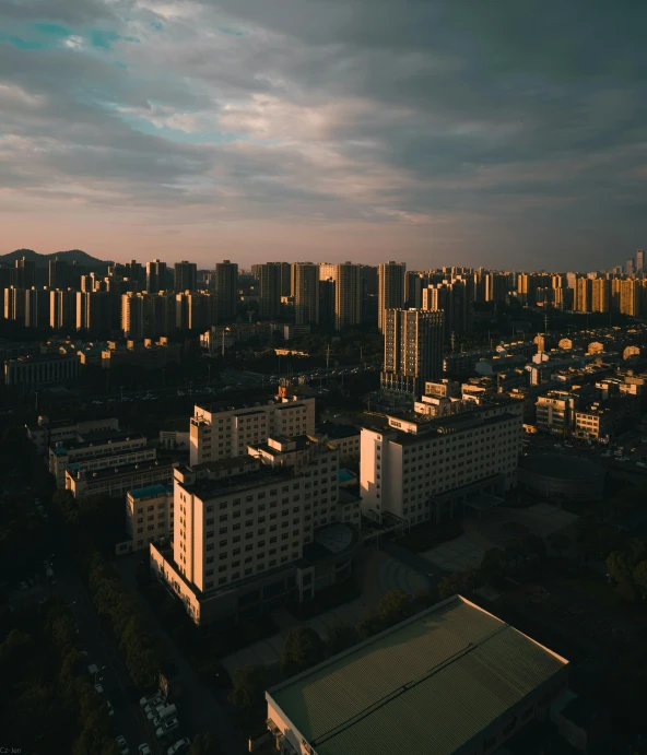 large white buildings and a city under a cloudy sky