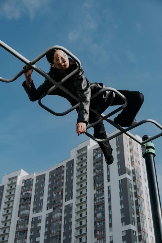 a man riding a metal rail on top of a street