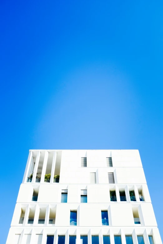 the large building is white and white, and has many windows