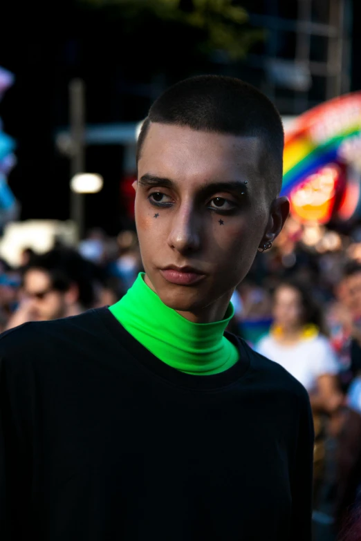 a boy wearing a black shirt and green collar