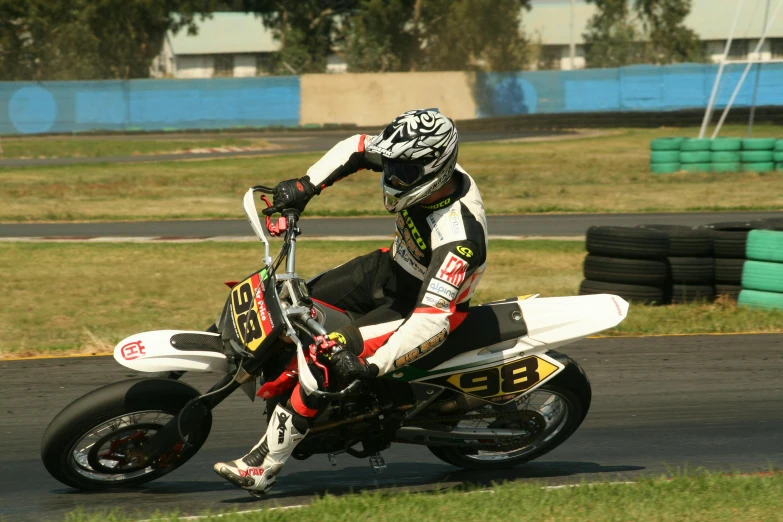 motorcycle racer turning around the corner of a track