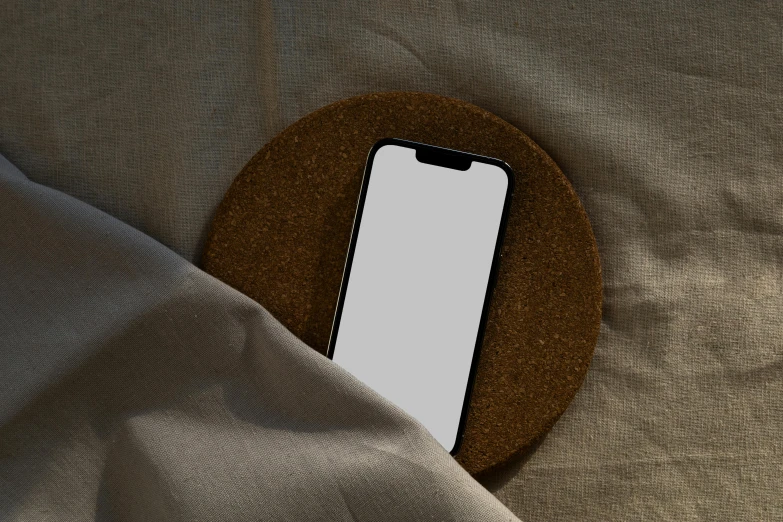 the iphone case lies on a fabric surface