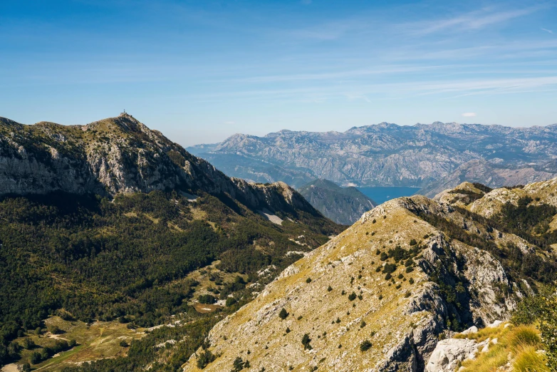 a mountain range with some trees on each side