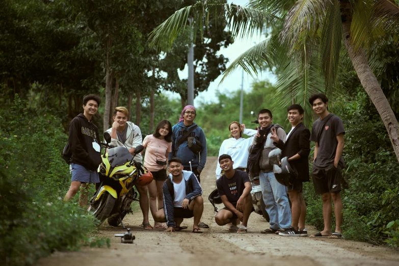 a group of people that are standing together in the dirt