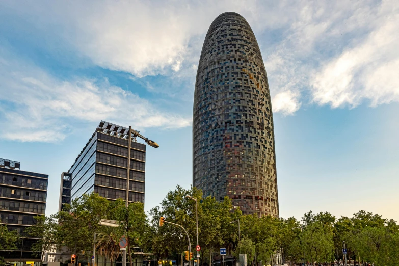 a very tall building surrounded by some trees