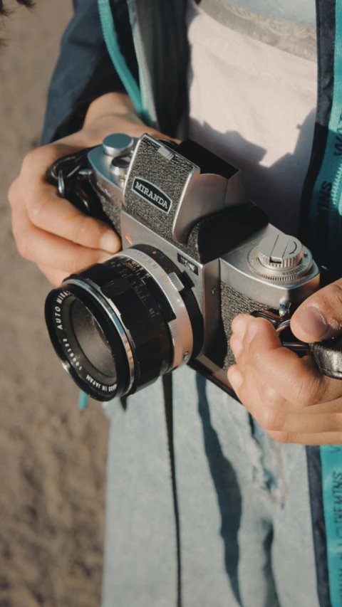 a person holding a camera up to their face