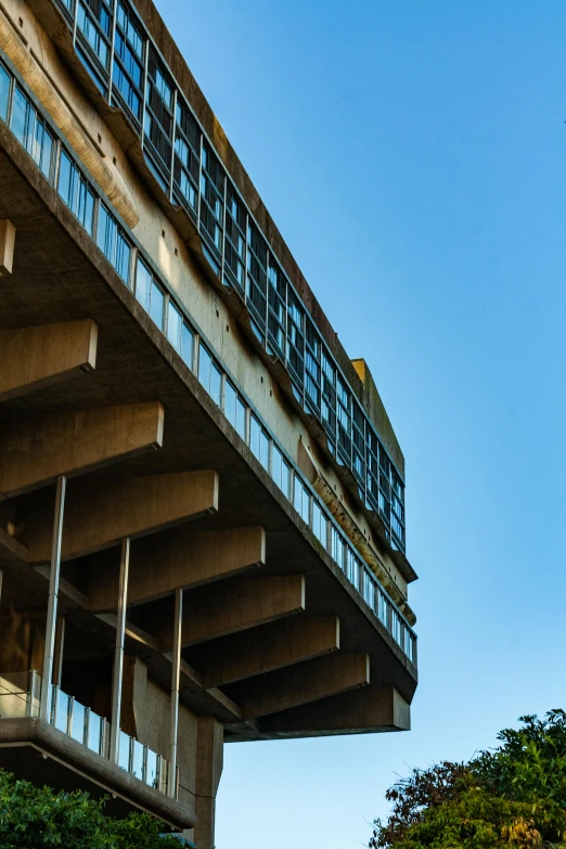 a large building with lots of windows and a ramp