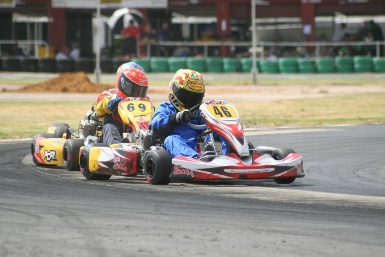 two people racing on a go kart track