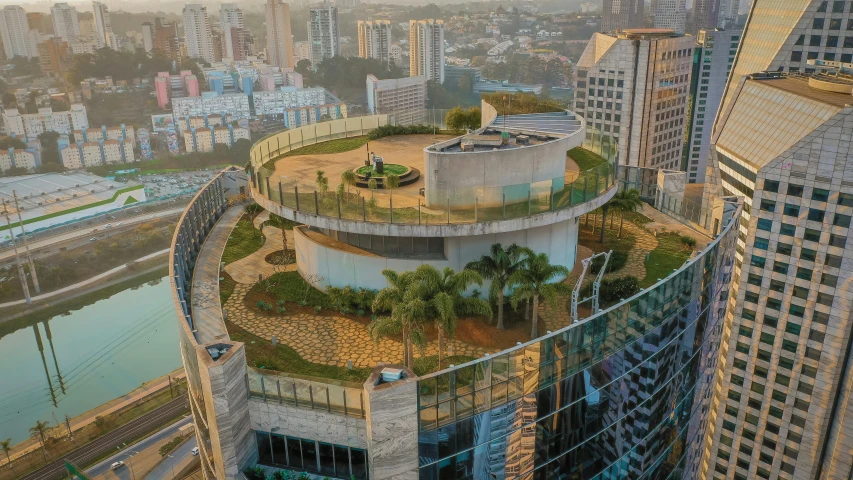 a high rise building with a green roof