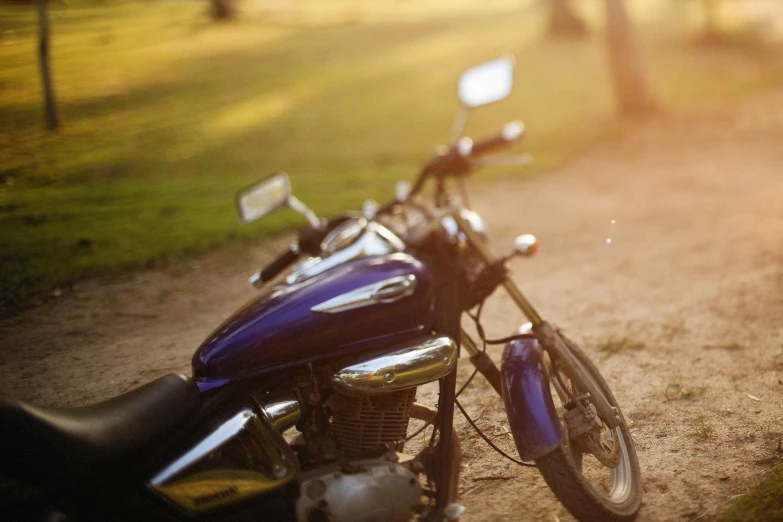 a motorbike that is sitting next to the road