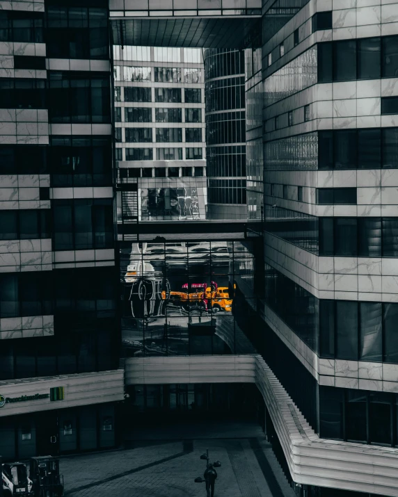 there is a tall black and white building in the middle of the city