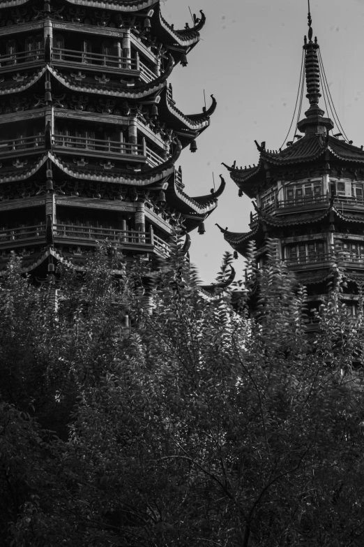 a black and white po of the roofs of a pagoda
