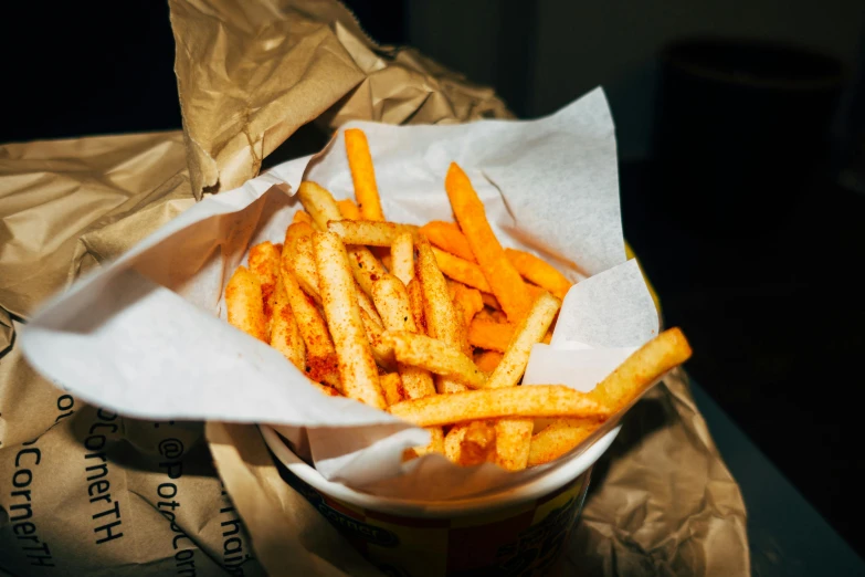 a basket that has french fries inside of it